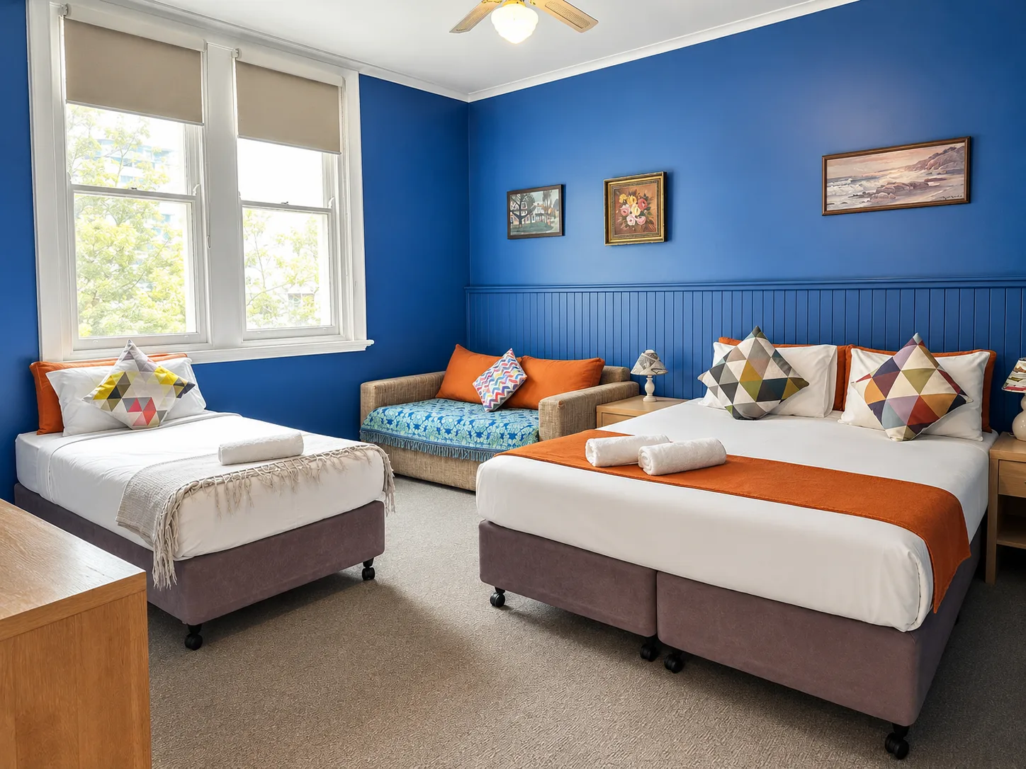 Family Room Standard with blue wall styling and bed at Vine Valley Inn Cessnock