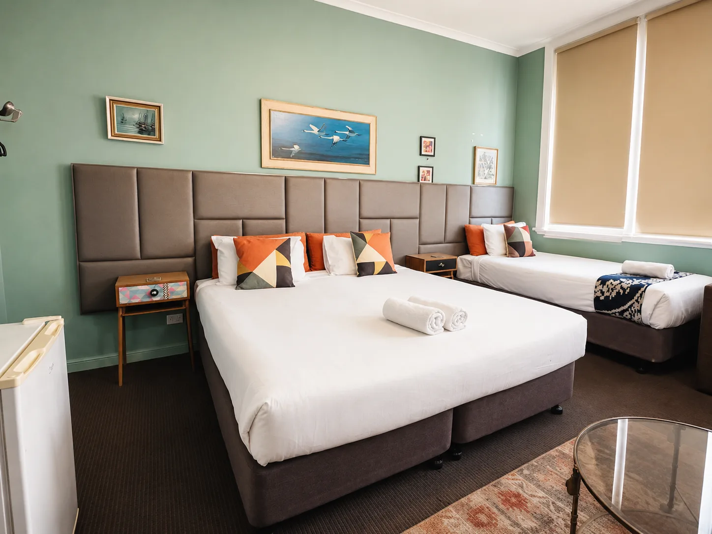 Family beds with bar fridge — Family Room at Vine Valley Inn Cessnock