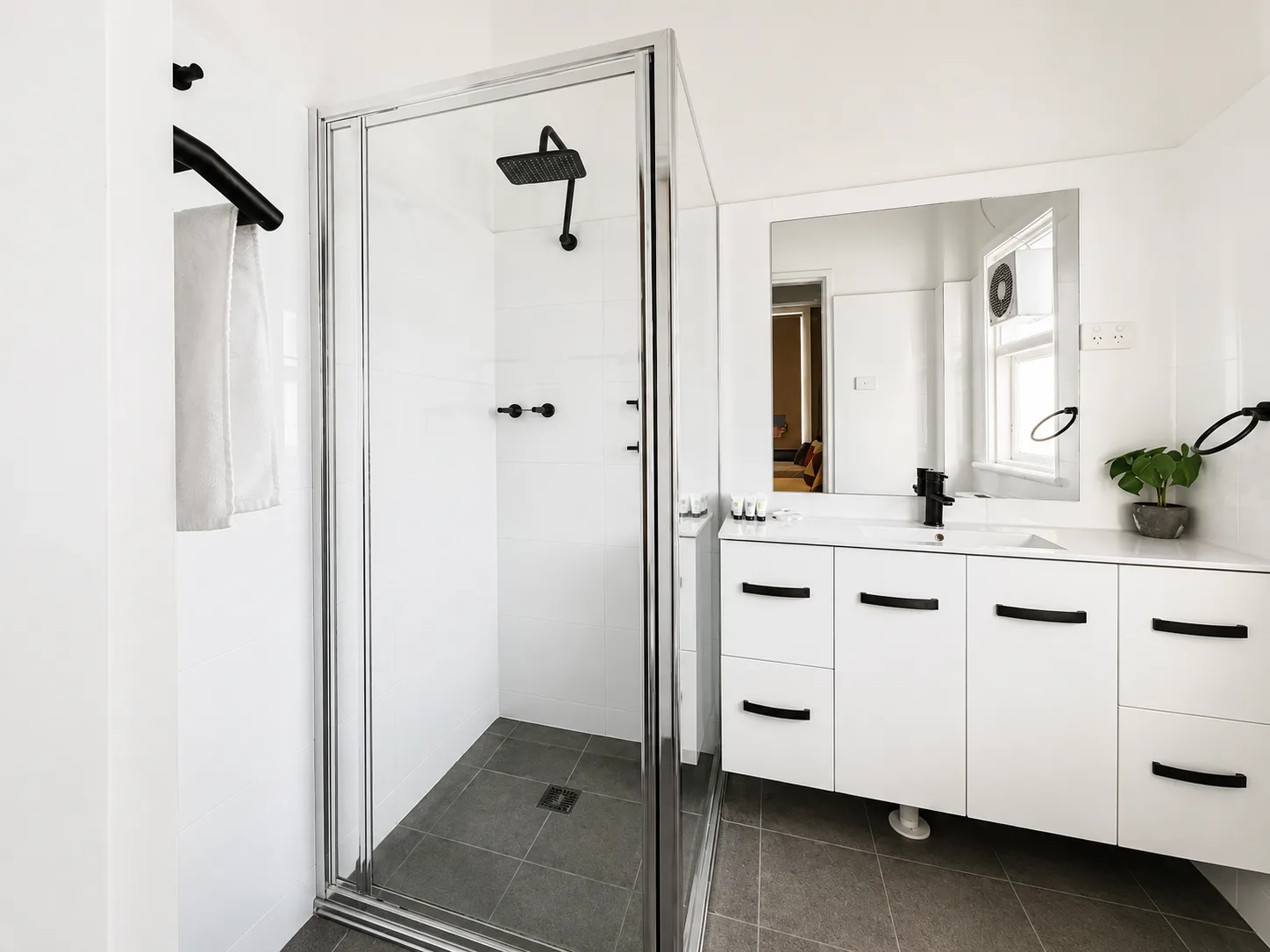 Ensuite with walk-in shower and vanity — Family Room at Vine Valley Inn Cessnock