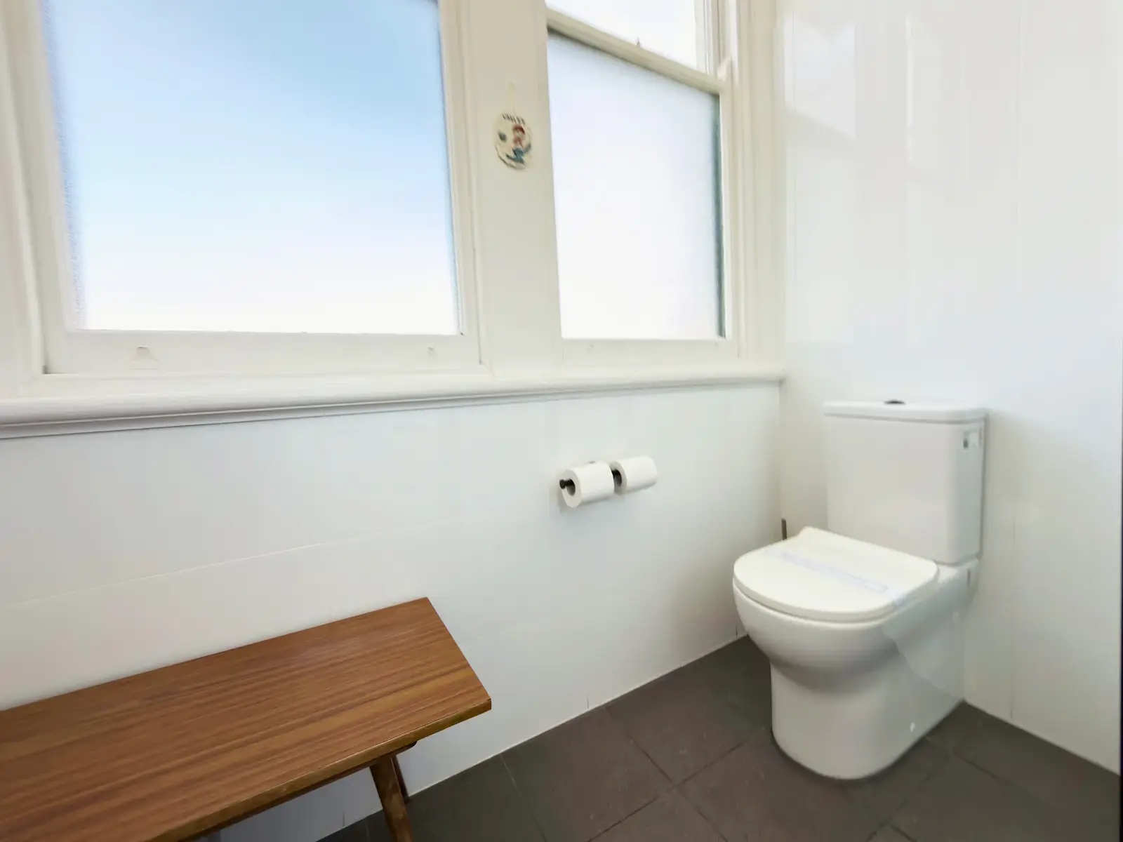 Bathroom with picture window — King Room at Vine Valley Inn Cessnock