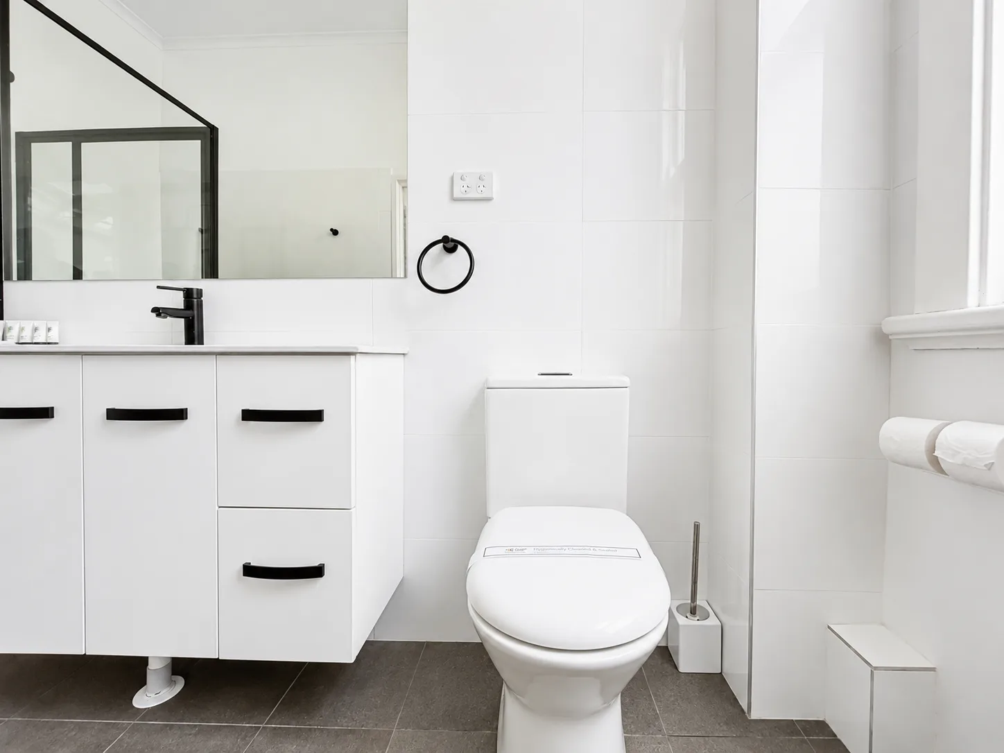 Ensuite with vanity, toilet and shower — Queen Deluxe Room at Vine Valley Inn Cessnock