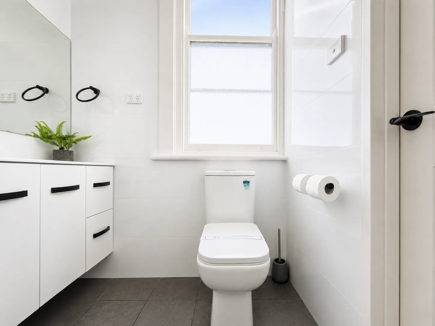 Bathroom with vanity and toilet — Twin Room at Vine Valley Inn Cessnock